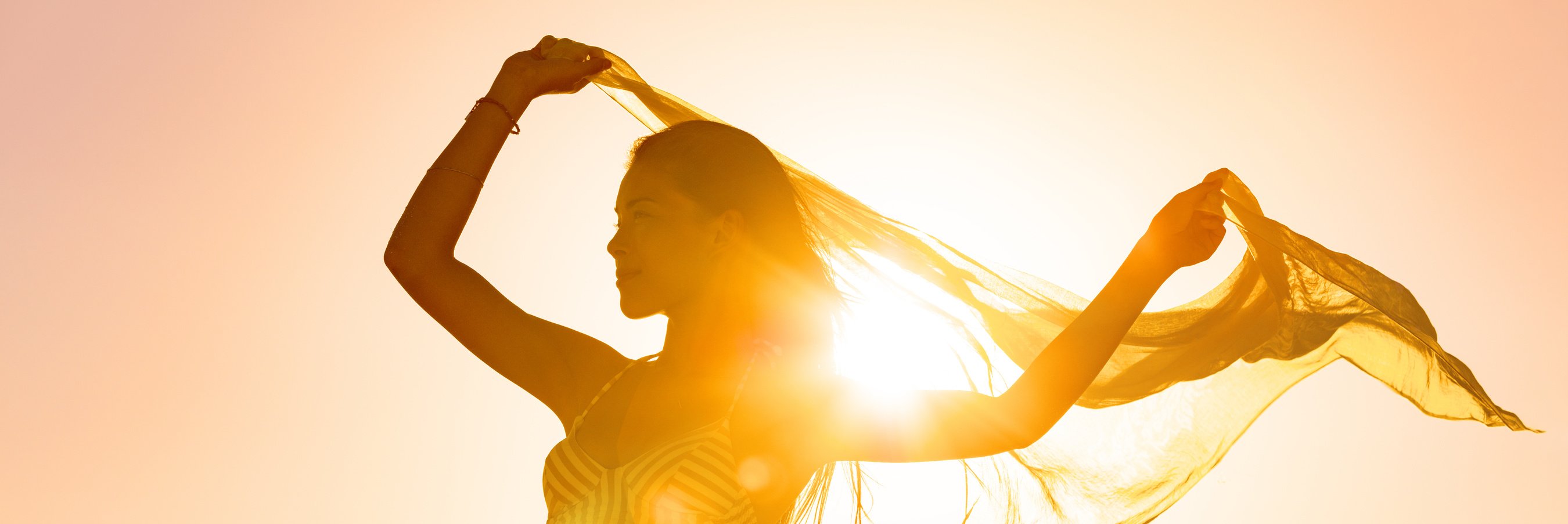 Beautiful Woman Happy Free in Sunset Glow Waving Scarf in the Wind Dancing in Sun Panoramic Banner. Silhouette Feminine Lady Freedom for Wellness and Healthy Living